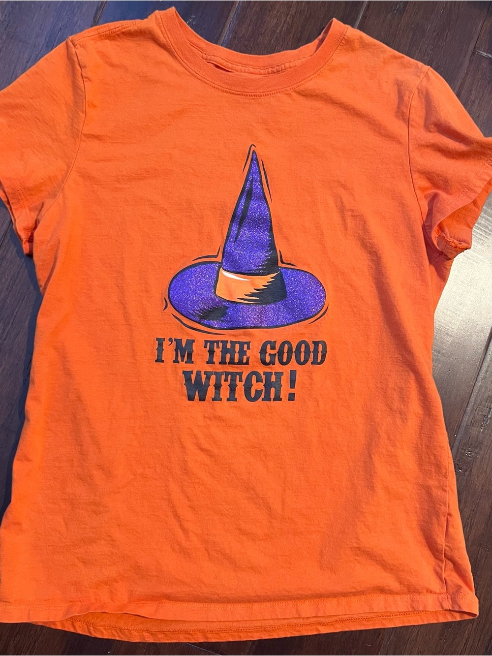 Womens’ Orange Short-Sleeve Tee with Purple Witch Hat Graphic